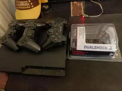 PS3 console with 25+ games and 3 controllers