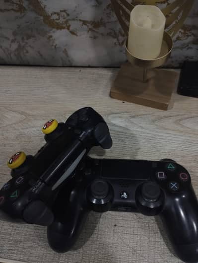 2 Original ps4 controllers in new condition available for sale