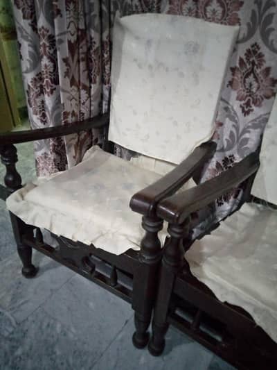 4 chairs and 1 table  with covers  .