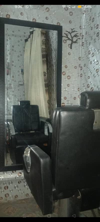 used salon chair and glass mirror