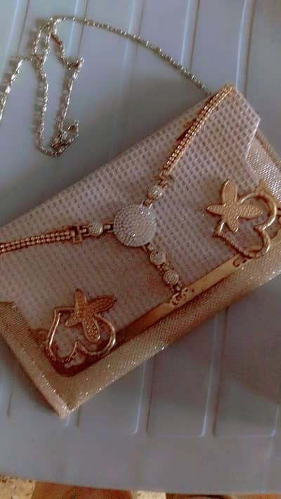Golden party wear clutch bag