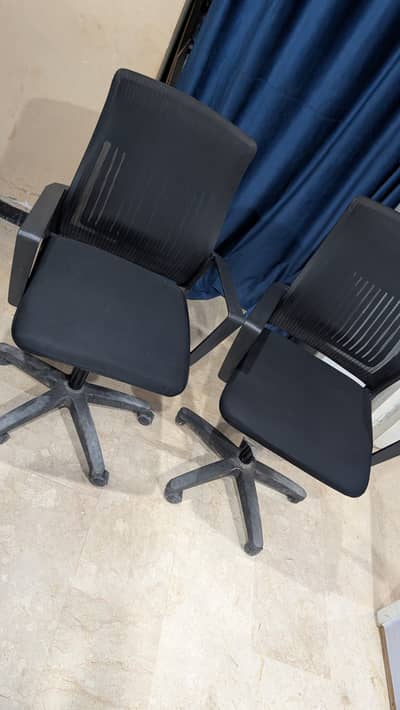 4 Office Revolving chairs.