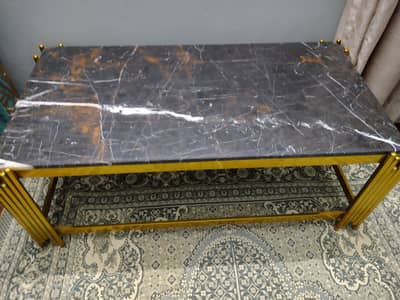 Center Marble table in black and gold theme