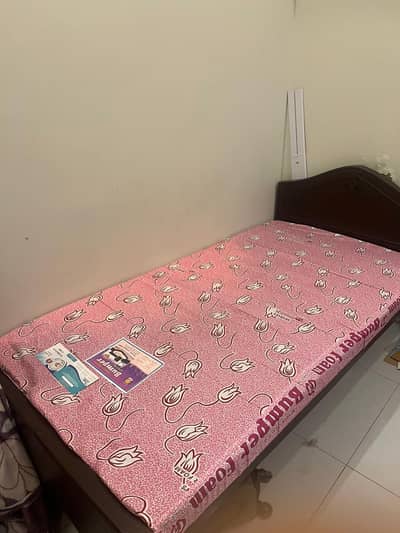 Single wooden bed in good condition