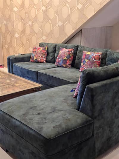 L shape seven seter sofa green shade