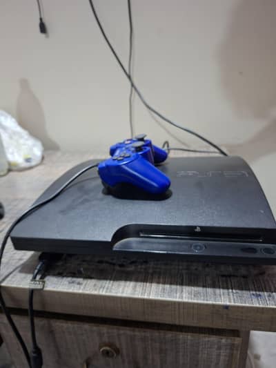 PlayStation 3 slim for sale with games and controller