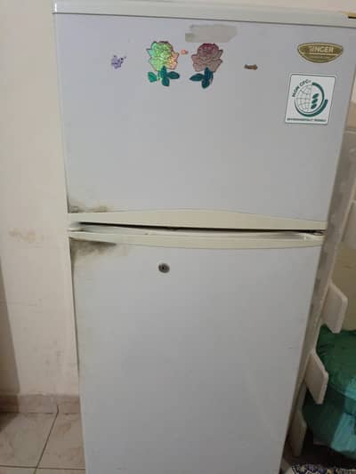 Singer Company, small fridge. 50 inch height. along with wooden stole.
