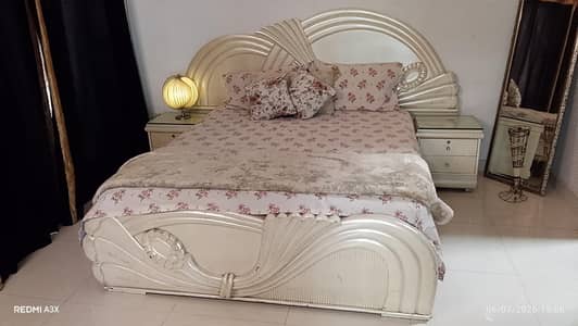 beautiful pearl white bed set with side tables and dressing table