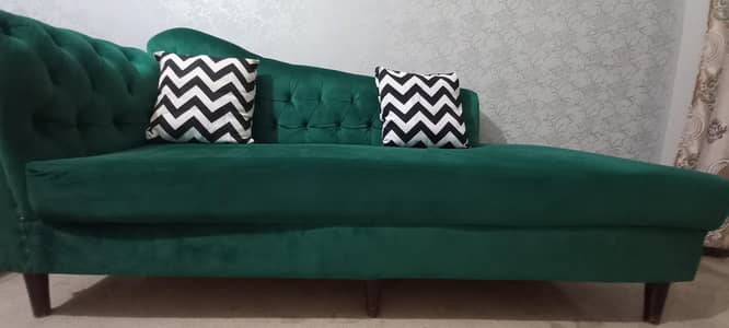 bottle green sofa with cushions