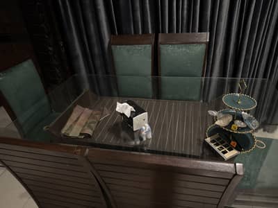 Wooden dinning table with glass and 6 chairs
