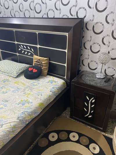 Bed with side table and dressing table in a very good condition