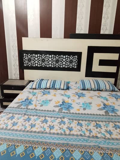 Double bed with side tables and dressing