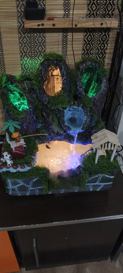 Indoor fountain waterfall with lights and smoke