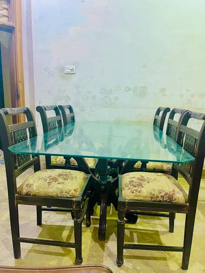 Glass Dining table with six chairs.