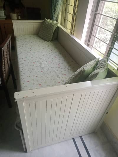 IKEA bed extendable with storage space.