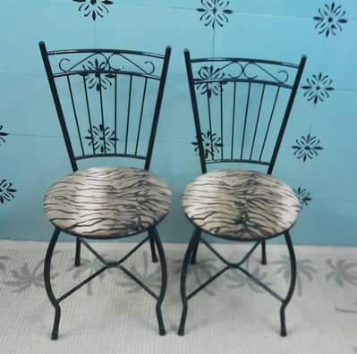 2_ solid iron chairs. new condition