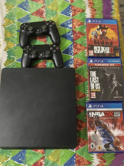 PS4 Slim 1TB with 2 controllers and 3 games