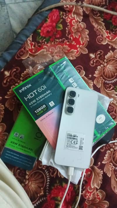 Infinix hot 60i condition 10 by 10 9 motth warnty total original box