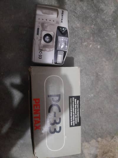 3 old phones + 1 Pentax PC-33 Camera
