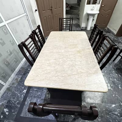 Dining table of wood and marble