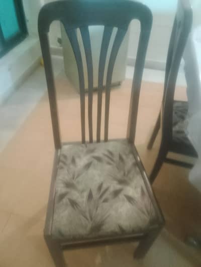 wooden dining table with 6 chairs.