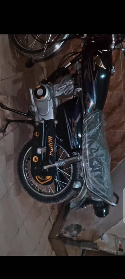 Honda 125 10by 8.5 condition totalgenuine black color