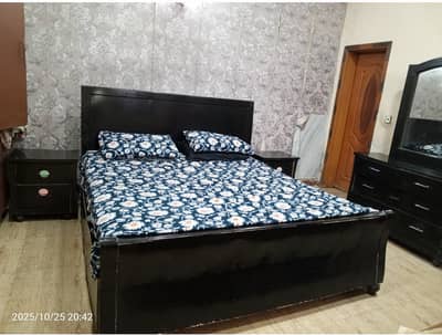 Bed set with dressing and side tables and another bed and center tabl