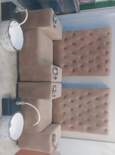 high back mani padi sofa with attached bowl with foot wash basin.