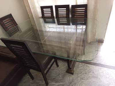 Dining table with glass top