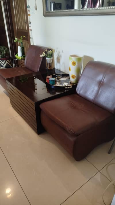Three Wooden Tables and Two Single Leather Sofa