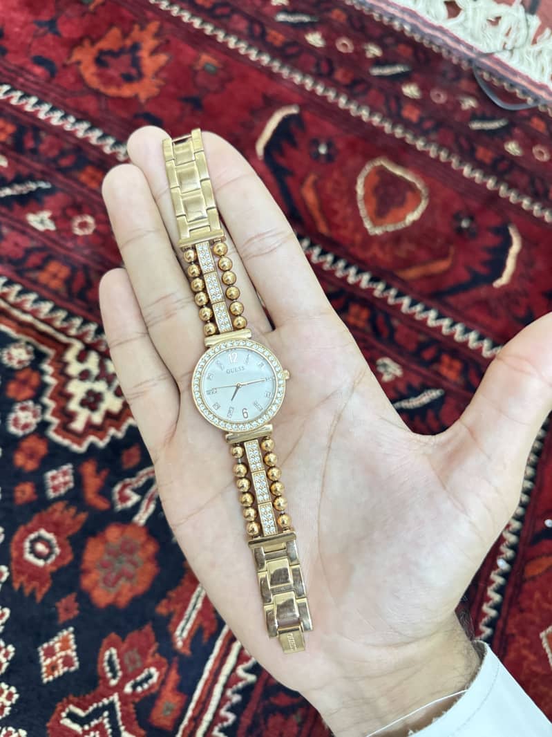 GUESS Gala Gold-Tone Analog Watch (Model: GW0401L2). 1