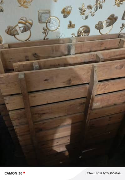 wooden double bed, king size. . .