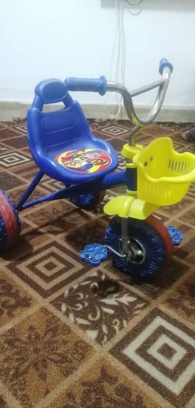 kids tricycle blue color with basket good condition