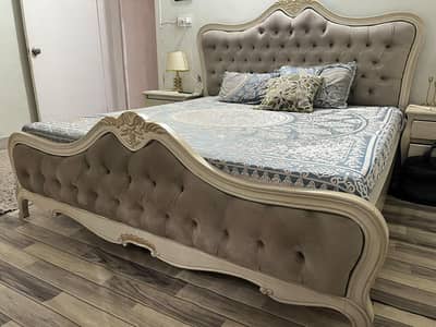 bed with side tables and mirror