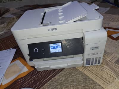 Epson ST C4100 Ali in one printer hai. new hai zyada use nhi hoa.