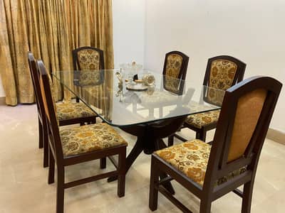Excellent Dining Table with glass top and Six chairs made of sheesham