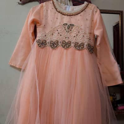 baby girl frok in peach color