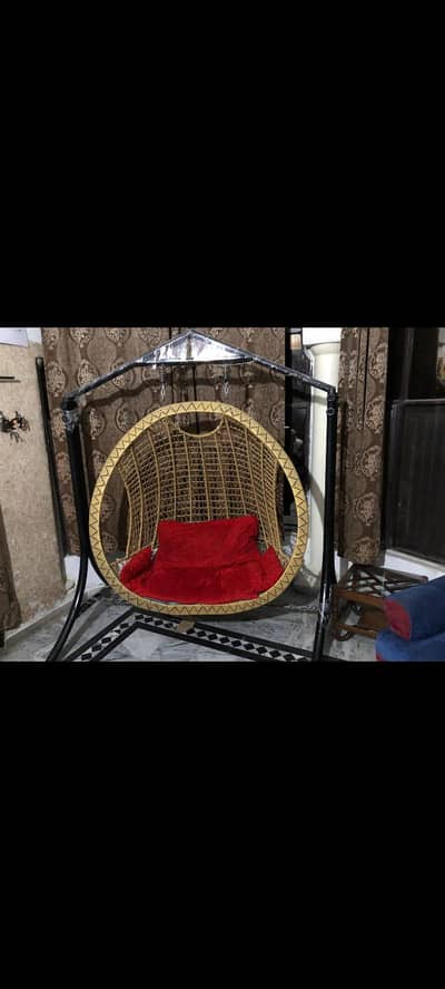Full size oval shaped swing sofa.