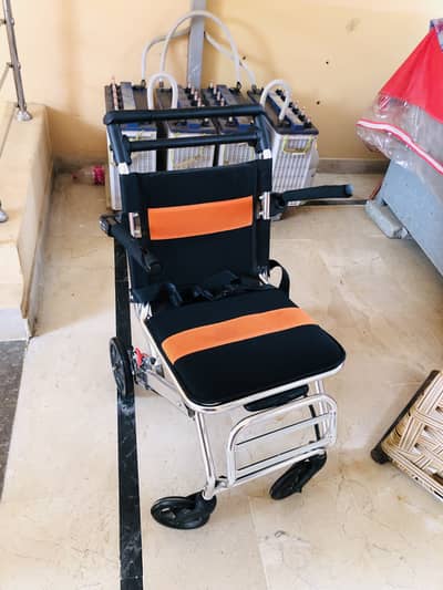 Portable wheel chair with safety beld