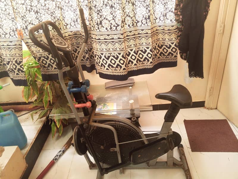 multi-function Exercise cycle with dumbbells Excellent condition 1