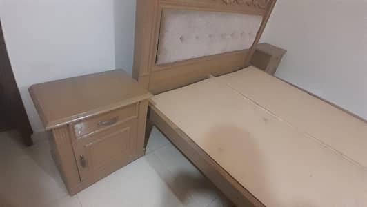 wooden bed with sidetables