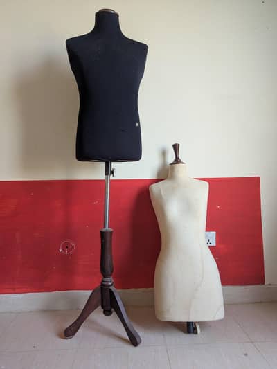 Male and female mannequin with stand