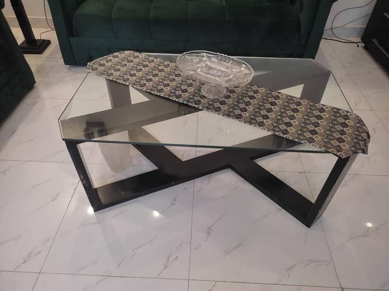 two green sofas and table 6