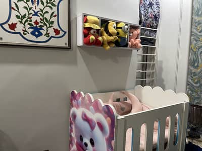 Baby cot with mattress and wall shelf