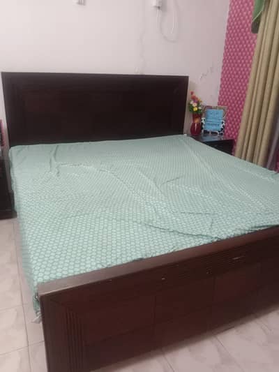 bed with two side tables and dressing