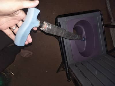 Toilet chair with kamote and a support stick