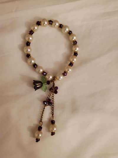 elegant pearl bracelet with floral charm