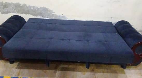 sofa com bad in blue colour