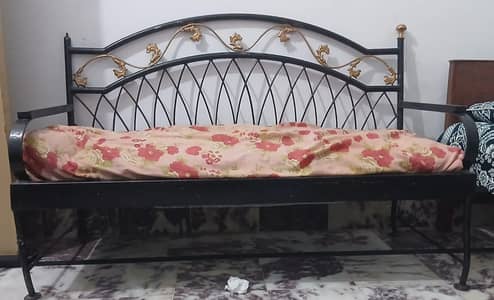 Two iron sofas