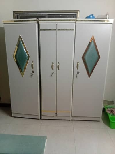 bed and cupboard with side table and matress